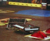 Spike Demon pushes BravePart towards the killsaws.