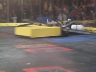 Electric Lunch pushes Jaws of Death against the spikestrip.