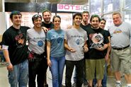 The Blue Flame and Witch Doctor teams with their runner up and first place trophies.
