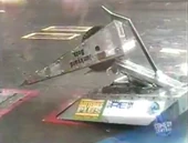 Zion clamps Spike Demon from the rear.