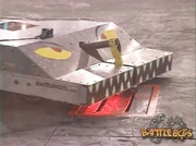 Revision Z briefly wedges under the killsaw cover with its lifter.