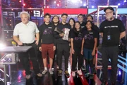 The Glitch team are presented with their pulverizer.