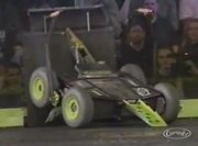 Diesector lifts War Machine against the arena wall.