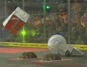 Crusher being tossed by Backlash and the killsaws.