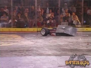 FlatBot gets pushed by Toe-Crusher.