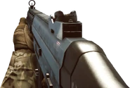 Holding the SG553.