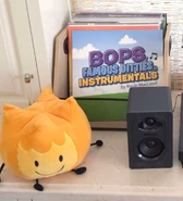 The cover alongside a Firey plush.