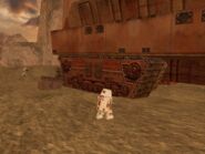 A Repair Droid stands next to a Sandcrawler in the Dune Sea