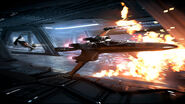 Black One and a TIE Silencer fighting inside the Battlecruiser.