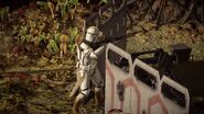 A 327th Star Corps clone trooper next to some Republic shield barricades