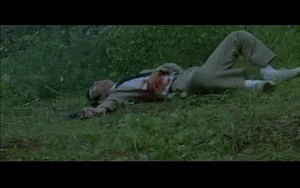 Kyoichi, moments before his death, after being shot by Shogo twice.