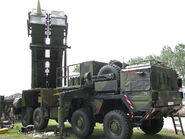 The MIM-140 is a Anti-ballistic missile interceptor mounted on a truck. Anti-ship missiles can also be mounted.