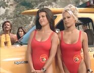 Baywatch - February 4, 1995 - A18 - A - Caroline (Yasmine Bleeth) & CJ (Pamela Anderson) In Their Red Lifeguard Bathing Suits