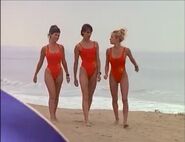 Baywatch - February 17, 1996 - 65 - Caroline (Yasmine Bleeth), Stephanie (Alexandra Paul) & C.J. (Pamela Lee) In Their Red Lifeguard Bathing Suits