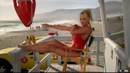 Pamela Anderson wearing her swimsuit in a Baywatch themed commercial for DirecTV