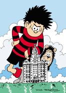 Dennis with Gnasher on a tower