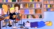Librarian fainting on the floor.