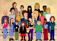 On the bottom left of the class photo in Tainted Meat