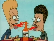 The boys bite the taco and breathe fire because of how hot it is.
