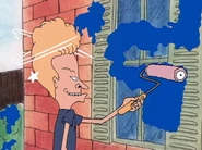 Beavis painting a 3 on the windows.