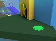 Cog, found at the top of Noob Shop (It was moved when the Star Hall was added in the 2018-07-11 update).