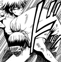 Oga deals a powerful strike to Takamiya's gut.