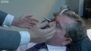 Mr. Rook stabs Martin in the eye with a pen.