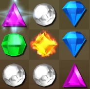 A Yellow Flame Gem, which the fire is slightly a more tone of orange than the other gems.