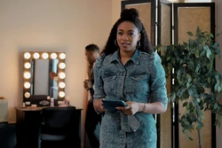 Lisa leads Jackie and the other girls into the back