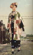 A lacecollar worn over the kimono to match lace stockings, and antique-looking roses to match the print of the haori.