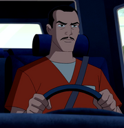 Captain Nemesis in a prison jumpsuit in Ultimate Alien