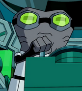 Driba wearing green-tinted goggles with grey rims in Malgax Attacks