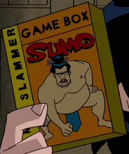 Kevin holding Sumo Slammers video game