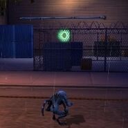 The next Plumbers' Badge is directly across from the one on the awning in a fenced in area. Spidermonkey is, again, the best character to reach this Plumbers' Badge.