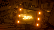 The message near the radio in Sammy's Office, which is a reference to a lyric in the original "Build Our Machine" song.