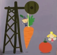 Holly and Ben next to a carrot and tomato