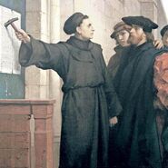 Marcin Luter przybija tezy do bram kościoła w Witenberdze