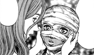 Luca bandages Casca's face to ward off people.