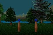 In-game view of the rift machine, comprising two short wooden posts each topped by a blue crystal. The posts stand on a grassy area in the Dimwood, backed by trees, a river, and mountains under a blue sky.