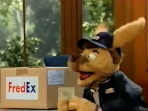 Fred with a FredEx Package