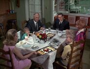 The family finally sits down to lunch.