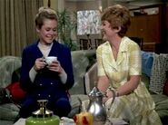 Samantha and Gretchen have some coffee while their children play.