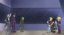 Theodore Glass as Ashtem with Gold Eye and Silver Eye speaking to Valt Aoi, Rantaro Kiyama, Daigo Kurogami, Wakiya Murasaki, and Cuza Ackermann