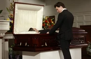 At his funeral, his son Georgie telling him not to worry.