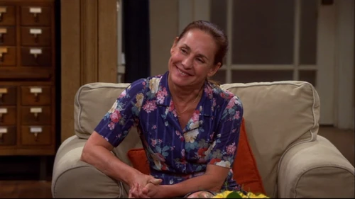 Mary smiling at Leonard and Penny being happy.