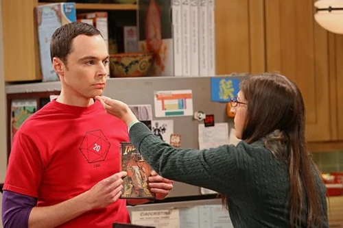 Amy's comment drops Sheldon's jaw, so Amy closes his mouth.