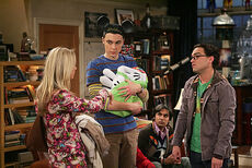 Sheldon returns from Disneyland with Penny.