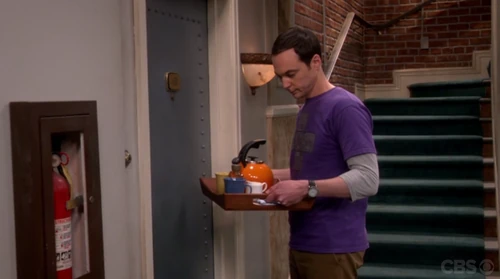 Sheldon can't knock, his hands are full.