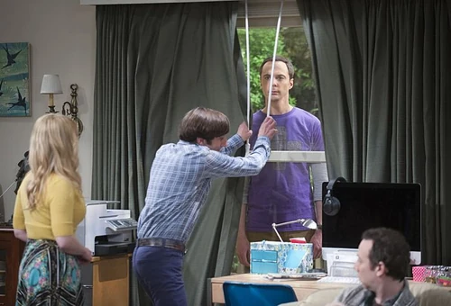 Howard closes the drapes to hide Sheldon.