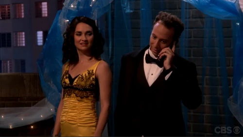 Stuart gets a call during their picture.